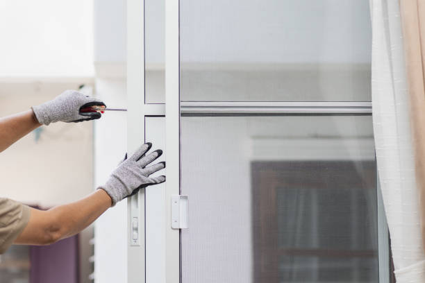Technician fixing a hard-to-open sliding glass door in Southern California